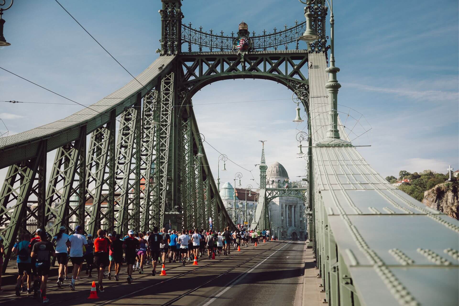 Budapest Marathon it’s one of Europe’s must-run events. Every October, the Hungarian capital turns into a true running festival: for two days, more than 30,000 runners from around the world take over the banks of the Danube to explore a city steeped in history and culture. As you race across Budapest’s iconic bridges, past Buda Castle, the Hungarian Parliament, and Margaret Island, your route becomes a journey through heritage, energy, and emotion. And because there’s more than one way to experience Budapest, the event offers nine different race formats—from a 5K fun run to the legendary 42.195 km marathon. But before you line up at the start of the Budapest Marathon, you’ll need to secure your bib and complete your registration.